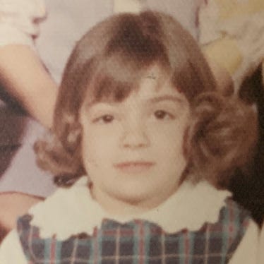 a young Joy McClain with curls in her kindergarten school photo