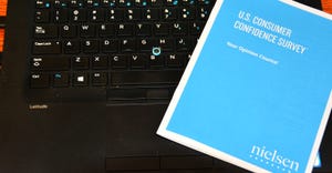 Nielsen U.S. Consumer Confidence Survey cover on keyboard
