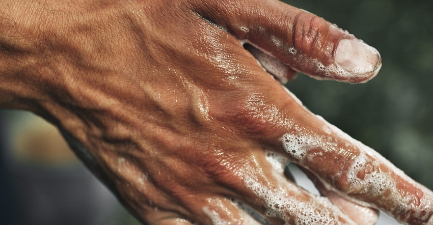 Close up shot of hands being washed with soap