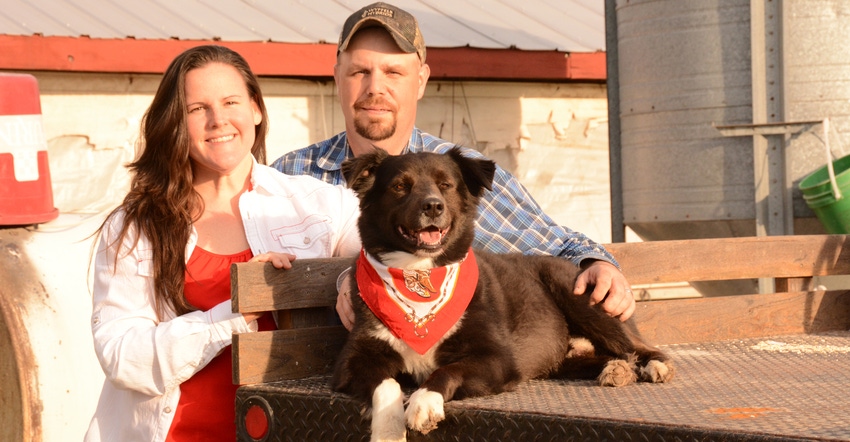 Missy and Dustin Cothern with Colby the farm dog