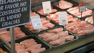 case of pork for sale in an international meat market