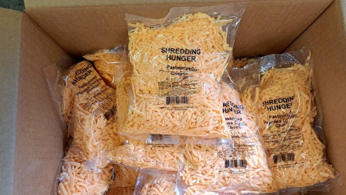 box of packages containing shredded cheese