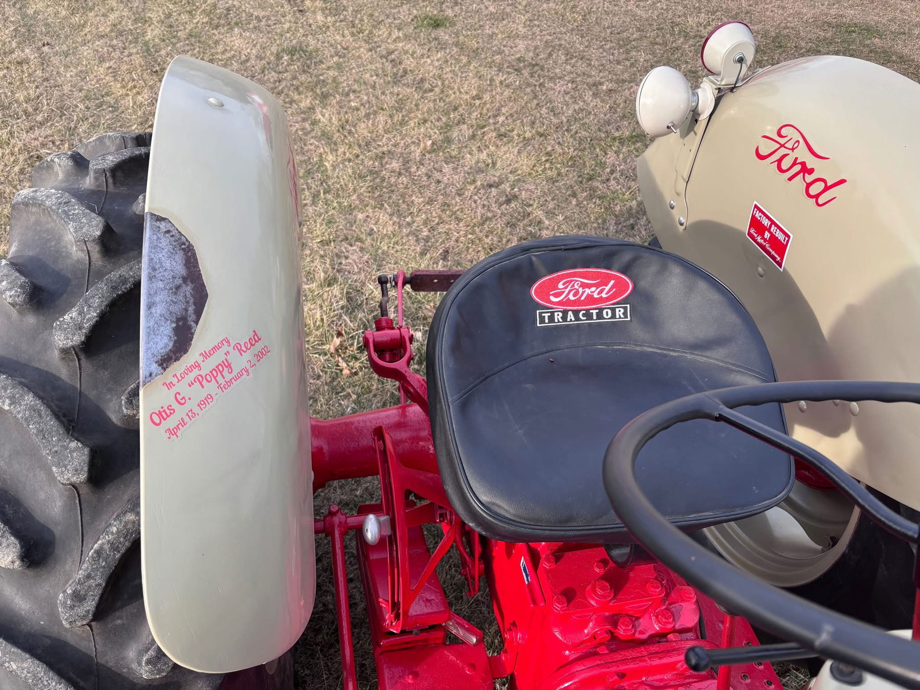 Grandson preserves grandfather's handprint on restored tractor