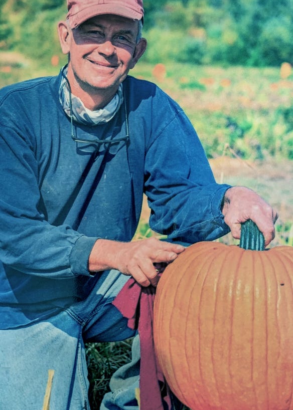Walt Gladstone holding a pumpkin