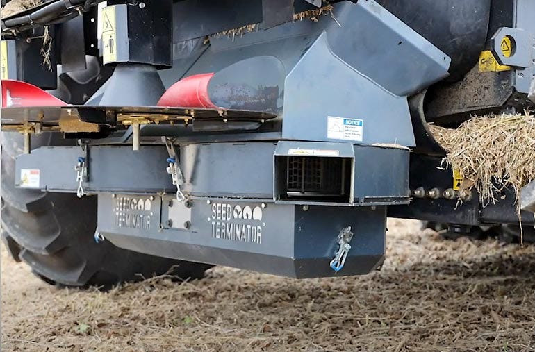 A close up of a seed terminator mounted on a combine