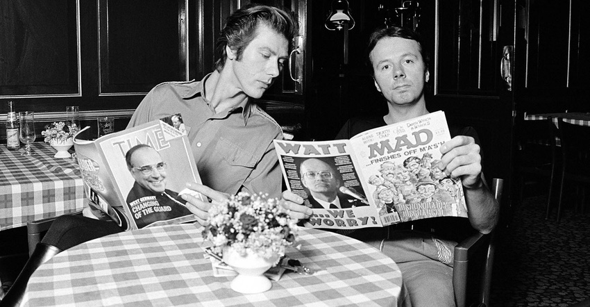Warren Cann and Billie Currie of Ultravox pose reading Time and Mad magazines in 1982 in Copenhagen, Denmark. 