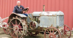 Rick Mindemann sitting on a 1927 model 10-20 McCormick-Deering standard tread tractor