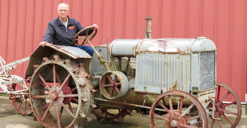 Rick Mindemann sitting on a 1927 model 10-20 McCormick-Deering standard tread tractor