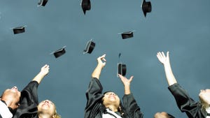 Graduates tossing their caps