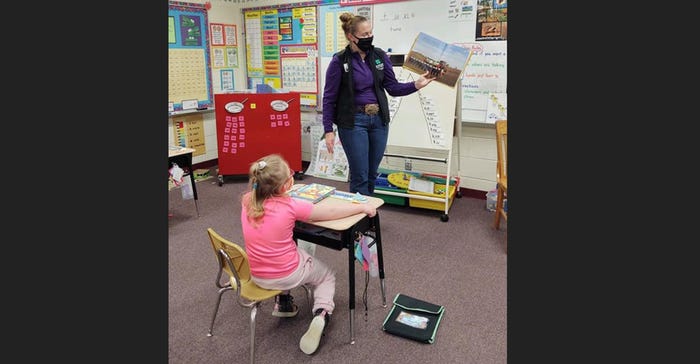 Ellsworth FFA President, Rachel Sebesta reads a Popping Corn book to a first-grade classroom. Ellsworth FFA President, Rachel Sebesta reads a Popping Corn book to a first-grade classroom.