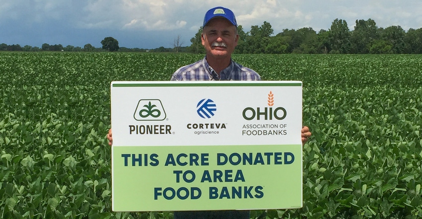 David Brewer, Pioneer sales representative, holds up a donation sign David Brewer, Pioneer sales representative, holds up a donation sign