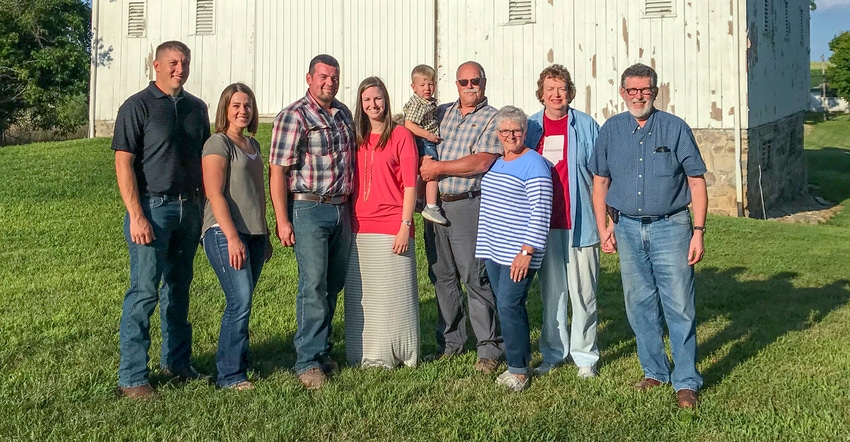 Mears family standing in front of barn Mears family standing in front of barn
