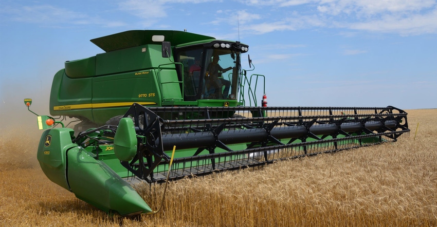 Combine in wheat field