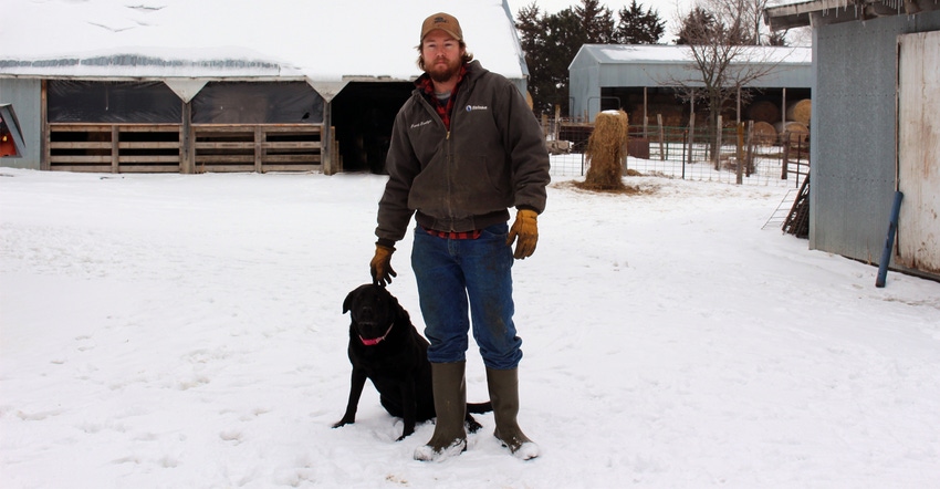 Alex Daake and his dog, Bella, pose for a photo on Daake's property near Beaver Crossing, Neb.