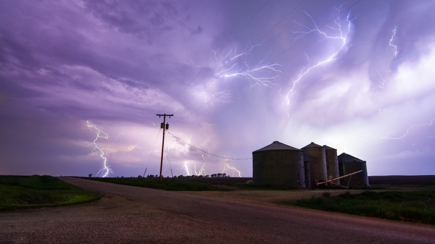 Lightning, storm cloue over grain bins Lightning, storm cloue over grain bins