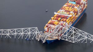 Cargo ship Dali sits in the water after running into bridge