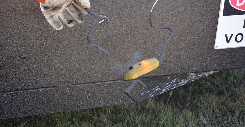 using a pickle technicians at HHD's show hot-line demonstrations to explain the importance of safety around power lines on th using a pickle technicians at HHD's show hot-line demonstrations to explain the importance of safety around power lines on th