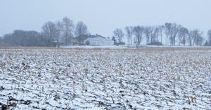 Iowa farm and snow-covered field 