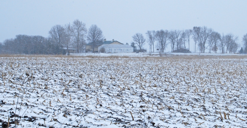 Iowa farm and snow-covered field 