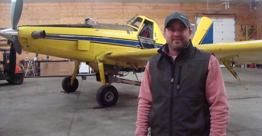 Nick Yoder in front of plane