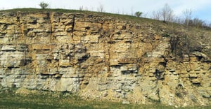 carbonate bedrock, also known as limestone, lies alongside a road north of Preston, Minn.