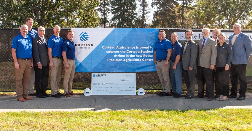 Corteva Agriscience presents the SDSU Foundation with a check to sponsor the Corteva Student Atrium in the Raven Precision Ag