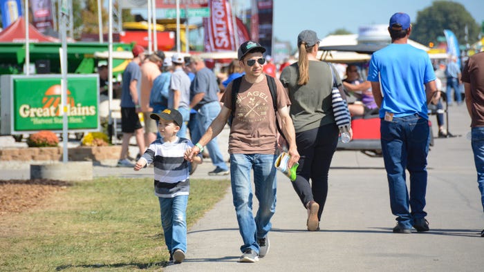 people on the street at the Farm Progress Show