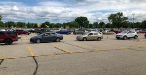Vehicles lined up in a parking lot