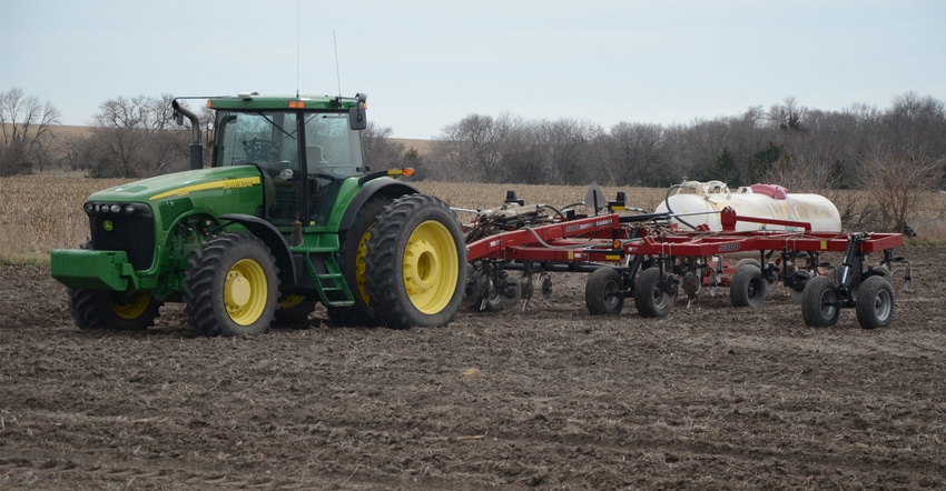 sprayer applying anhydrous ammonia to field sprayer applying anhydrous ammonia to field