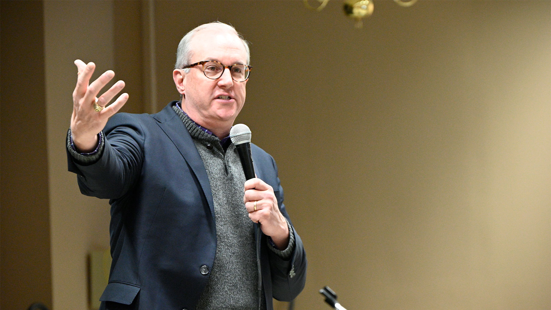 Chris Torres - Man speaking into a microphone