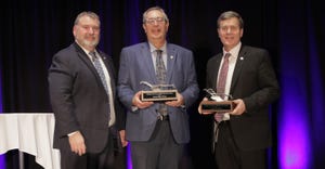 MFB President Carl Bednarski presents Sens. Roger Victory and Kevin Daley Silver Plow Awards for their support of Michigan ag