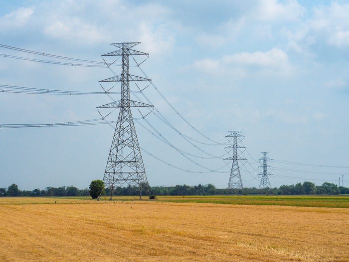 Thongchai Saisanguanwong/Getty Images - High voltage transmission towers in agriculture fields