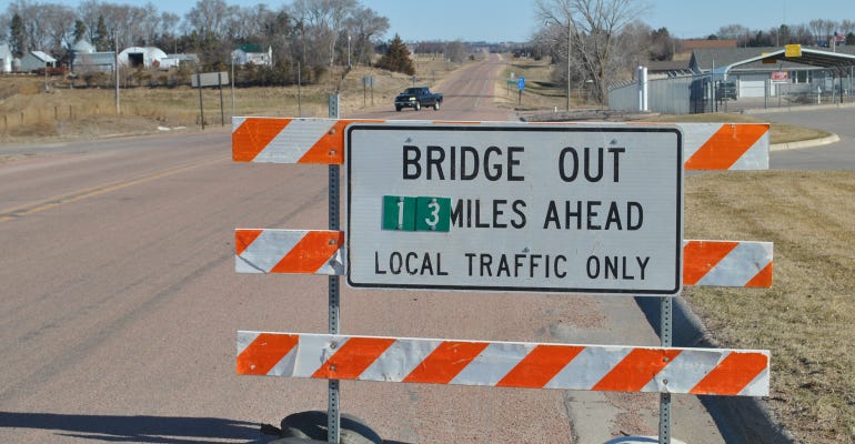 Bridge out 13 miles ahead sign
