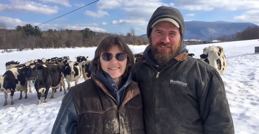 Hilda Fisk Haines and Steve Haines, stand outside on their dairy farm in Danby, Vermont
