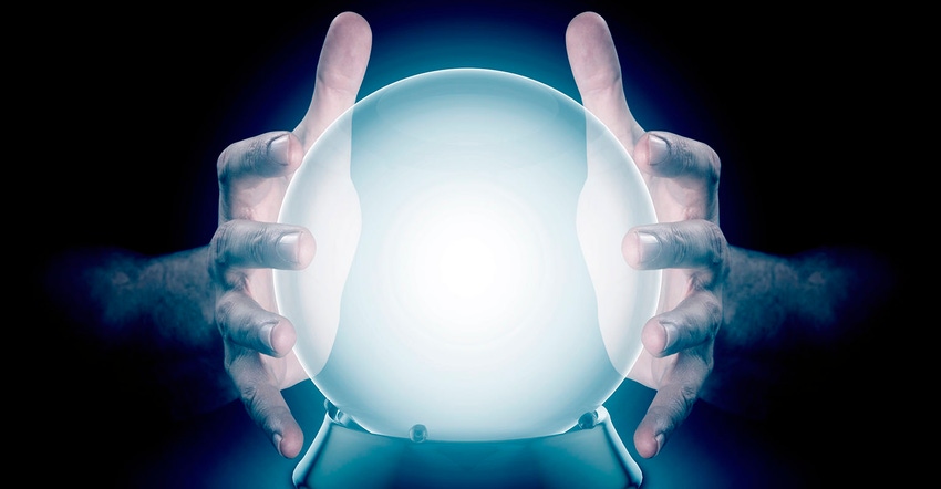 A pair of male hands surrounding a crystal ball conjuring up a hologram on an isolated ark studio background