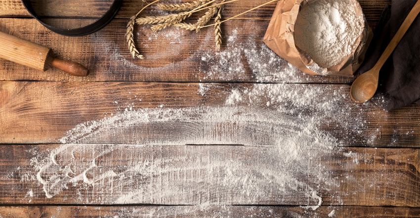 Baker workspace with flour and rolling pin