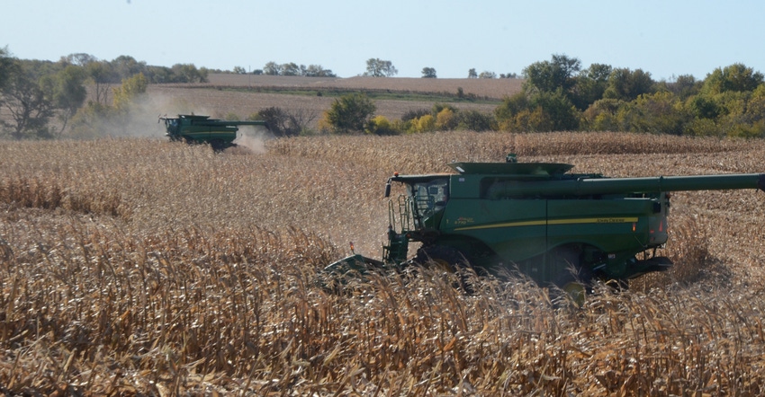 combines in soybean field