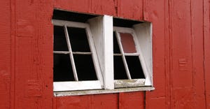white open windows on red barn