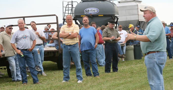 Jim Gillespie (far right in photo) talking to a group of people at field day