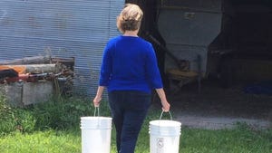  Woman carrying buckets