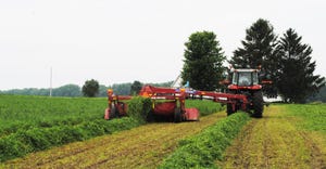 equipment in field harvesting forages
