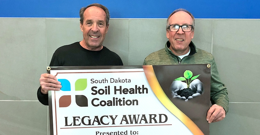 Gene (left) and Craig Stehly the SD Soil Health Coalition’s Legacy Award 