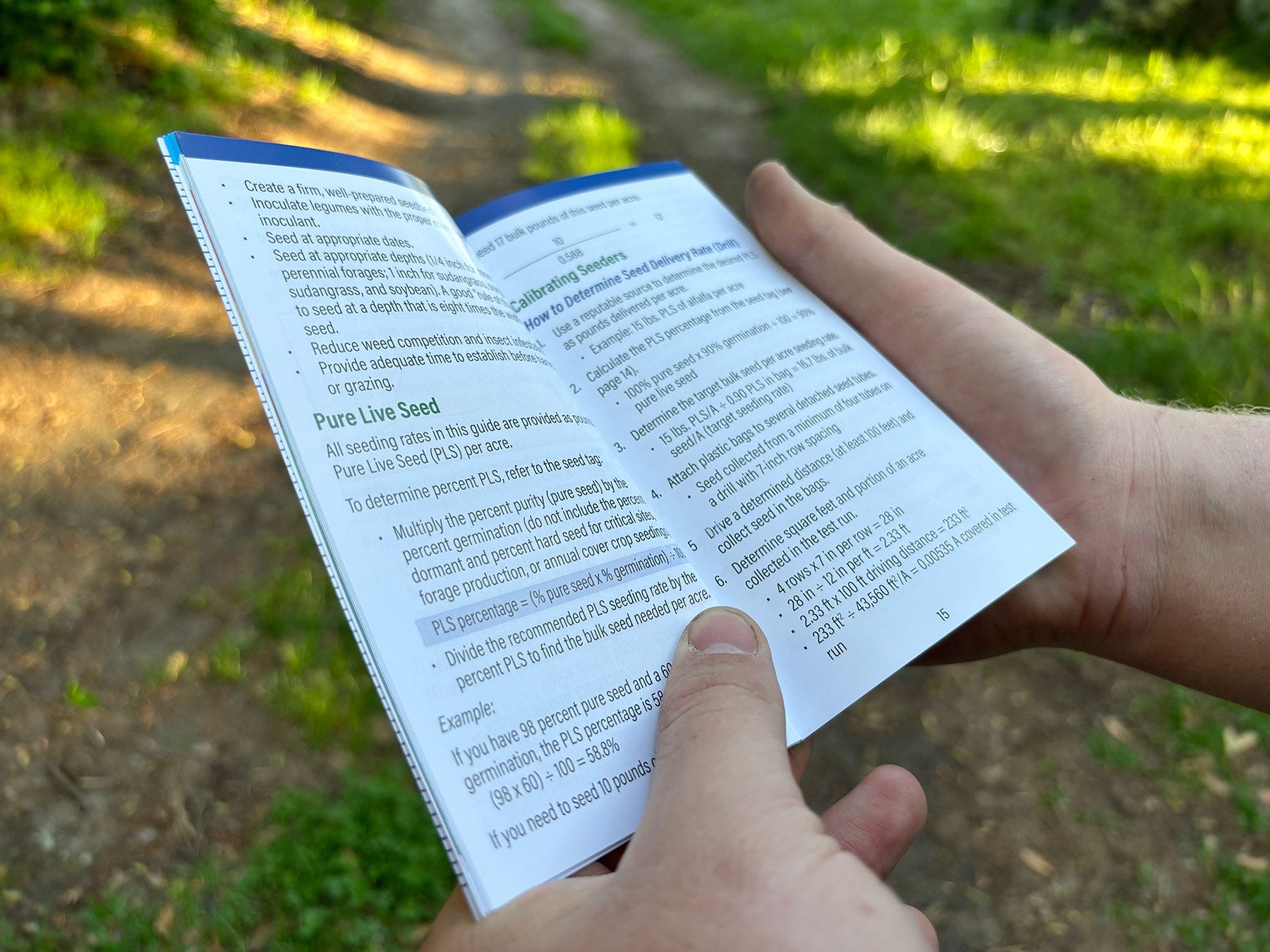 A close up of a hands holding a small booklet