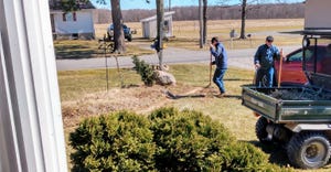 Two men working doing yard work