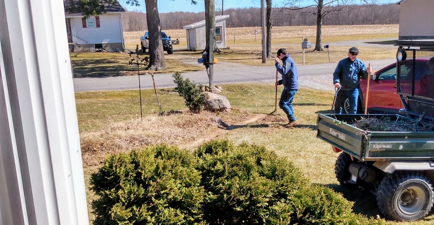 Two men working doing yard work Two men working doing yard work
