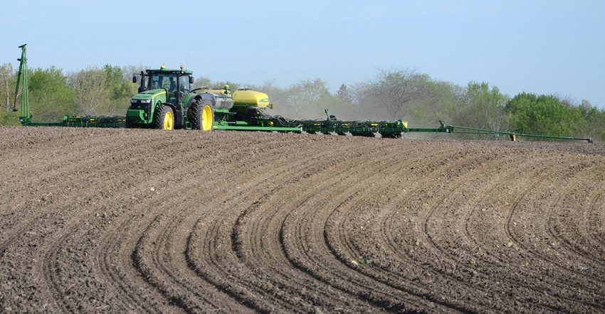 tractor doing spring fertilization