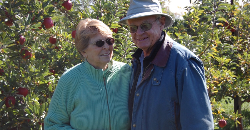 captured Robert Crane with his now late wife, Luetta, in their orchard
