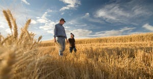 Father and son in field