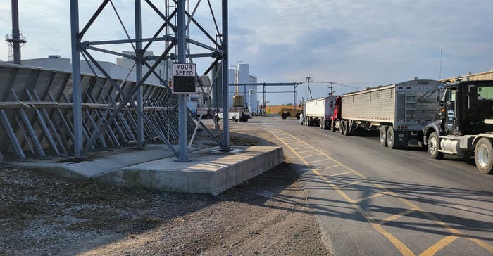 line of trucks at grain elevator