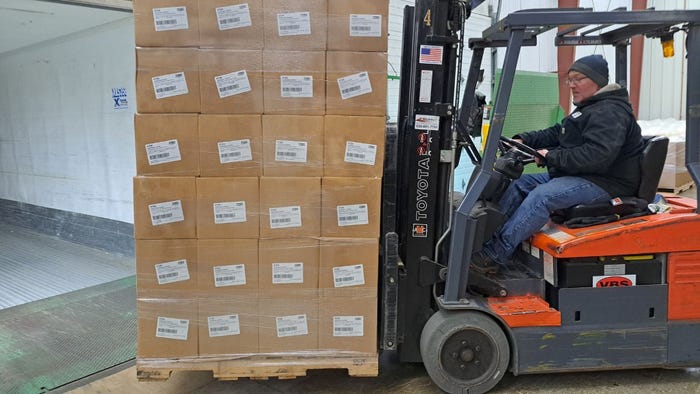 man driving forklift full of boxes